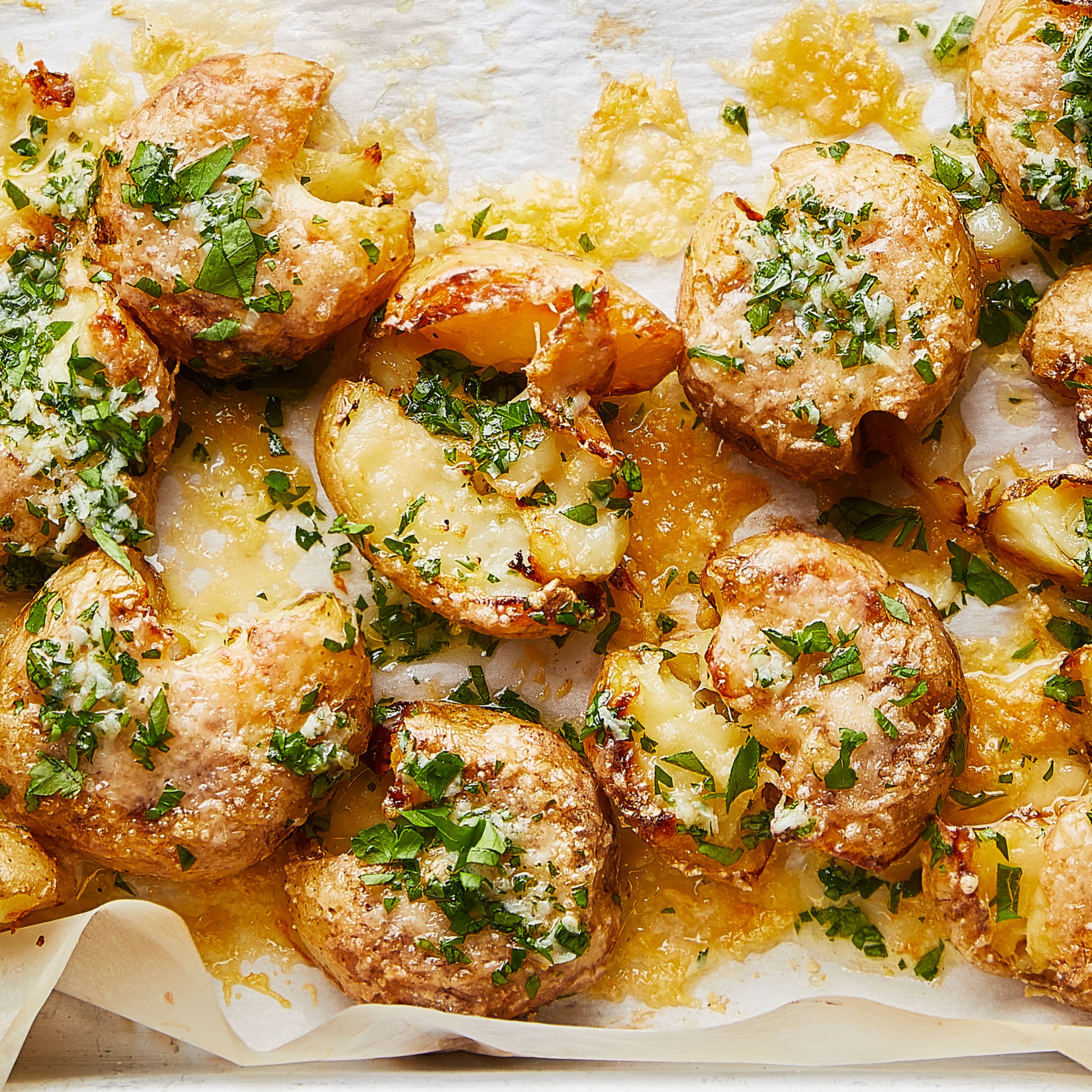 Cheesy smashed new potatoes with garlic butter